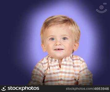 Adorable baby with plaid shirt on blue background