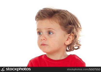 Adorable baby with two years old and red jersey looking to the side isolated on a white background