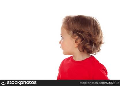 Adorable baby with two years old and red jersey looking to the side isolated on a white background