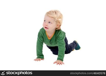 Adorable blond baby crawling isolated on a white background
