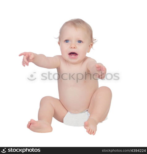 Adorable blond baby in diaper crying sitting on the floor isolated on a white background