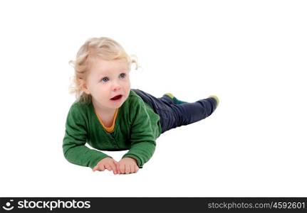 Adorable blond baby lying on the floor isolated on a white background