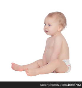 Adorable blonde baby in diaper sitting on the floor isolated on a white background