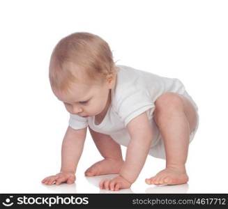 Adorable blonde baby in underwear crawling isolated on a white background