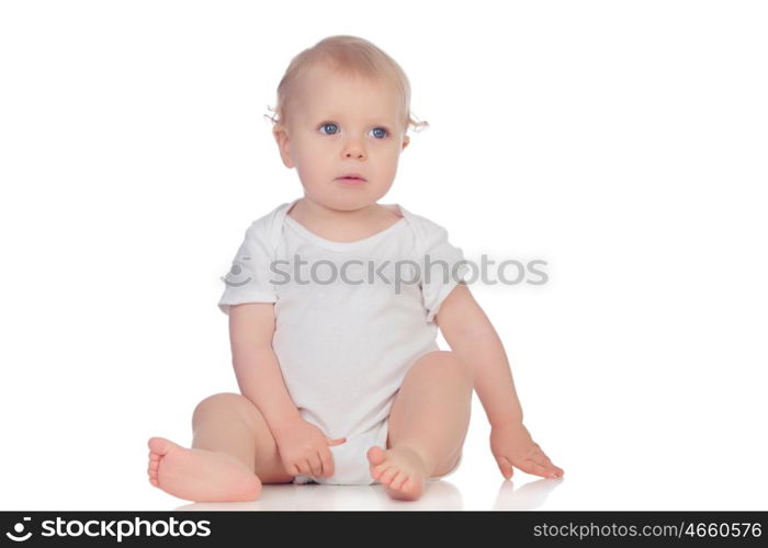 Adorable blonde baby in underwear sitting on the floor isolated on a white background