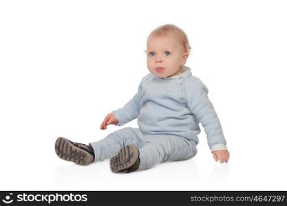 Adorable blonde baby sit on the floor isolated on a white background