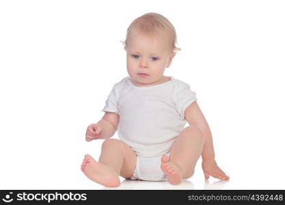 Adorable blonde baby sitting on the floor isolated on a white background