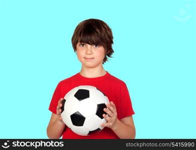 Adorable boy dreaming about being soccer player isolated on blue background