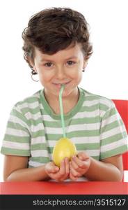 Adorable boy drinking juice of lemon on a over white background