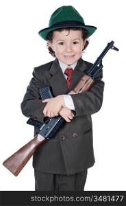 Adorable boy in a suit with machine gun