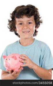 Adorable boy with pink piggy bank in his hands a over white background