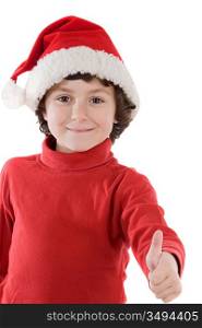 Adorable boy with red hat of Christmas saying O.K. on a over white background