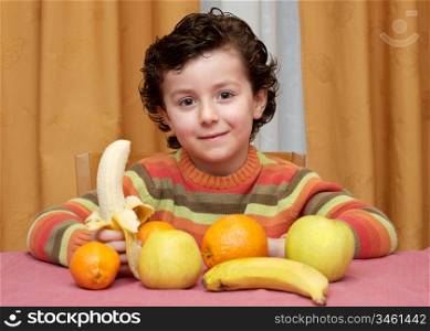 Adorable child eating fruit - focus in the face -