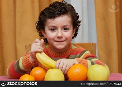 Adorable child eating fruit - focus in the face -