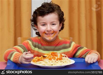 Adorable child eating in his house - focus in the face -