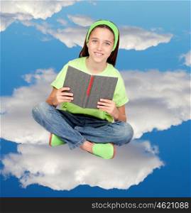 Adorable child reading sitting on the clouds