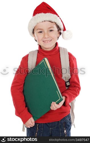 Adorable child studying with Santa Claus hat