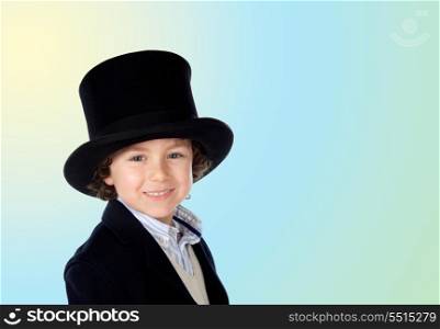 Adorable child with a black top-hat isolated on a over blue and yellow background