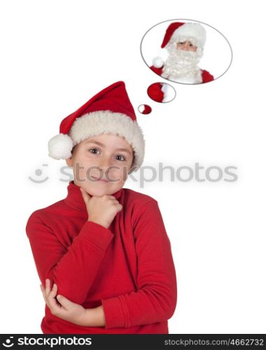 Adorable child with Christmas hat thinking in Santa Claus isolated on a white background