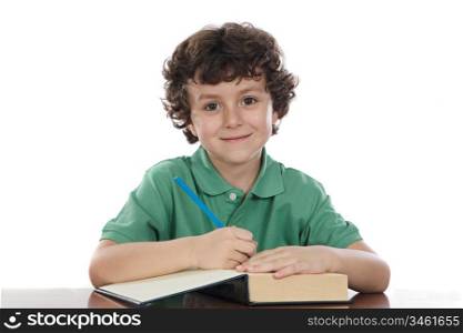 Adorable child write in book a over white background