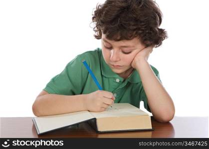 Adorable child write in book a over white background