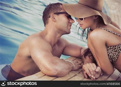 Adorable couple at the swimming pool