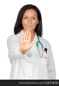 Adorable doctor saying Stop with focus on the hand isolated on white background