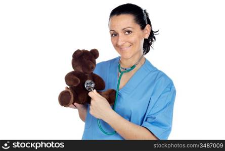 Adorable doctor with a teddy bear in her arms a over white background