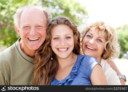 Adorable family of three smiling at camera
