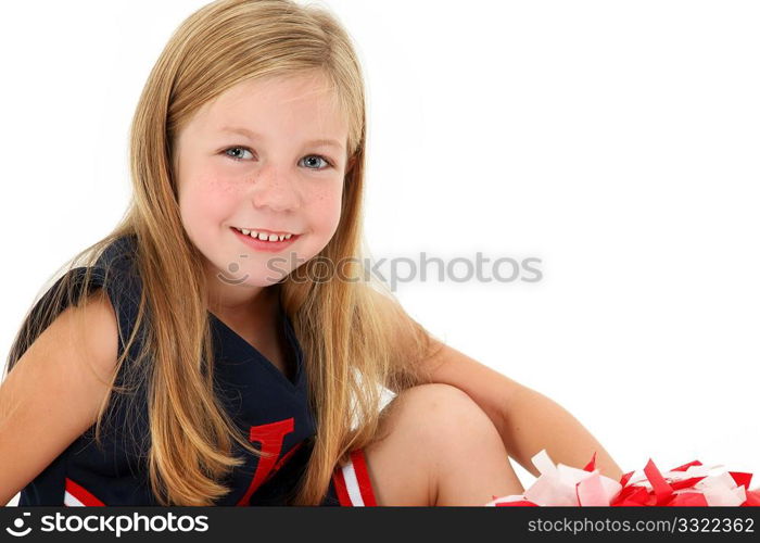Adorable five year old american girl cheerleader over white.