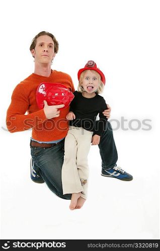 Adorable five year old with Dad wearing fire fighter hats