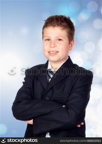 Adorable future businessman isolated on a bright blue background