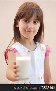 adorable girl drinking milk - focus in the face -