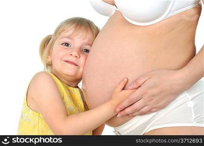 Adorable girl hugging belly pregnant mom&acute;s