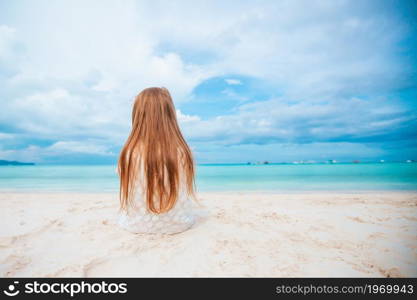 Adorable girl on a beach vacation. Adorable little girl at beach during summer vacation
