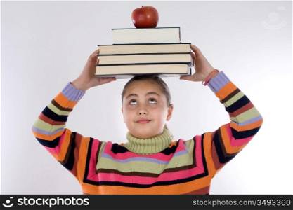Adorable girl studying with books and apple in the head