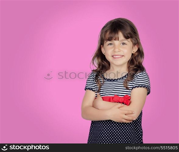 Adorable girl with a beautiful smile on a over pink background