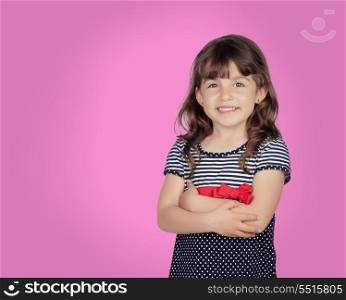 Adorable girl with a beautiful smile on a over pink background