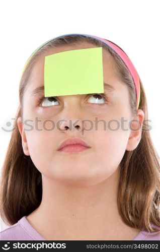 Adorable girl with a paper in her front isolated over white