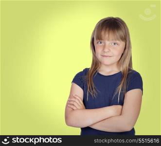 Adorable girl with blond hair on a over yellow background