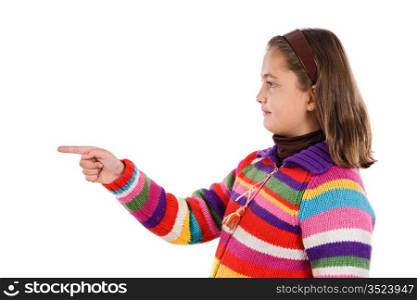 Adorable girl with woollen jacket pointing on a over white background