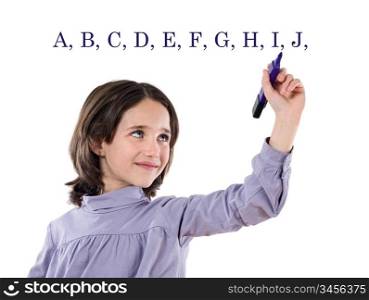 Adorable girl writing the ABC with fluorescent on a over white background