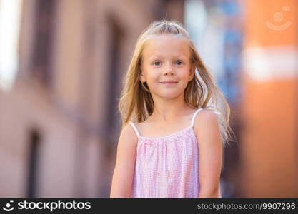 Adorable happy little girl outdoors in european city. Portrait of caucasian kid enjoy summer vacation in Rome. Adorable happy little girl outdoors in italian city. Portrait of caucasian kid enjoy summer vacation in Rome