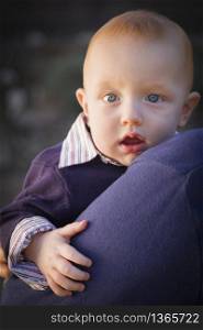 Adorable Infant Boy Portrait Outdoors with Dramatic Lighting.