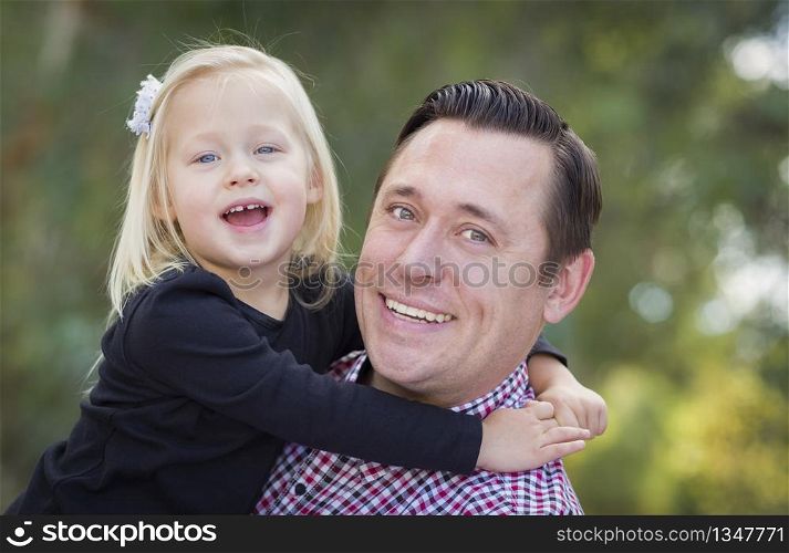 Adorable Little Baby Girl Having Fun With Daddy Outdoors.