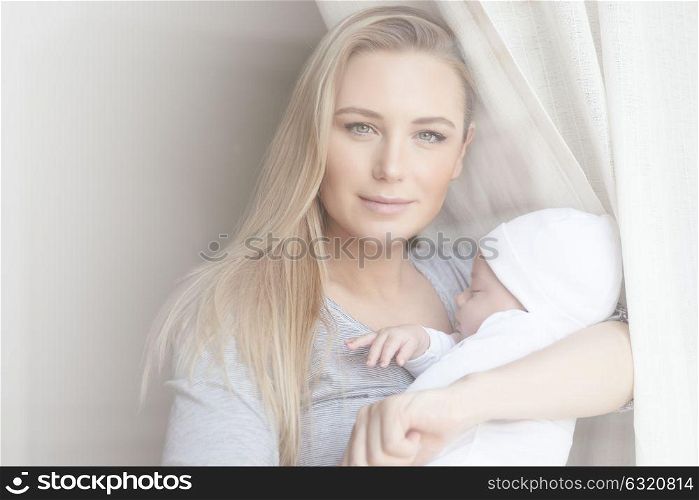 Adorable little baby with pleasure sleeping in his mothers hands, healthy and carefree childhood, new life concept, happy family life