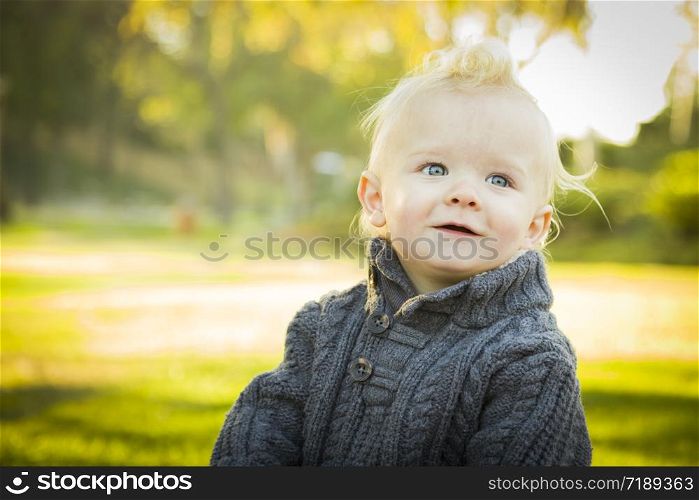 Adorable Little Blonde Baby Boy Outdoors at the Park.
