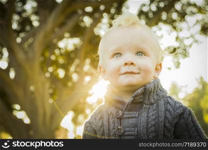 Adorable Little Blonde Baby Boy Outdoors at the Park.