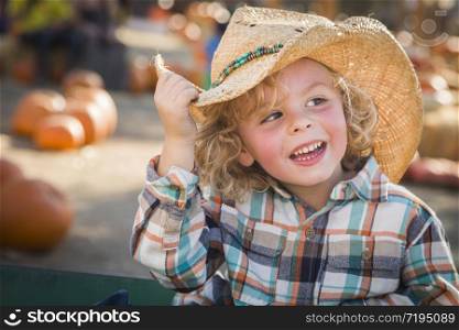 Adorable Little Boy Wearing Cowboy Hat at Pumpkin Patch Farm.