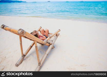 Adorable little girl at tropical beach on vacation. Adorable little girl have fun at tropical beach during vacation